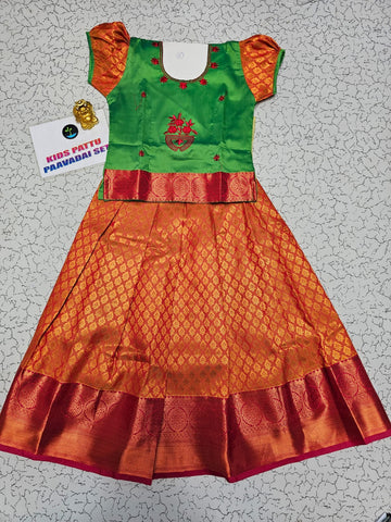 Kids green and orange pattu pavadai set with puff sleeve blouse and zari skirt from Sri Thulir Tex