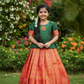 Kids green semi-silk top with pink and gold bridal silk pattu pavadai set by Sri Thulir Tex