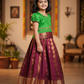 Kids Pattu Pavadai set with green top and maroon zari woven skirt from Sri Thulir Tex.
