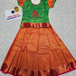 Kids pattu pavadai set with green semi silk top and orange bridal silk skirt by Sri Thulir Tex