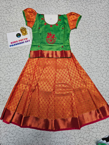 Kids pattu pavadai set with green semi silk top and orange bridal silk skirt by Sri Thulir Tex