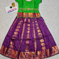 Kids Pattu Pavadai set with green top and purple zari woven skirt from Sri Thulir Tex.