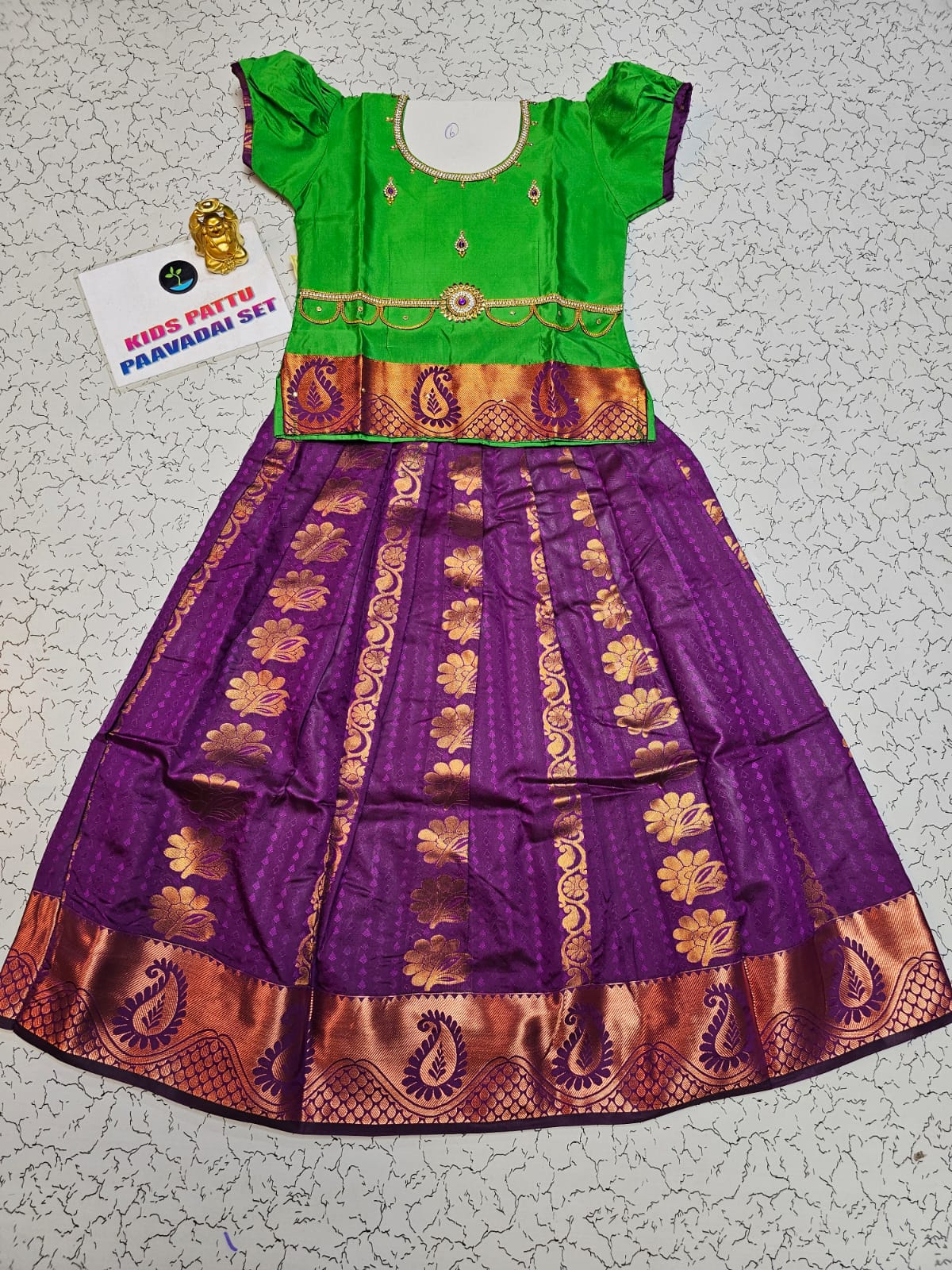 Kids Pattu Pavadai set with green top and purple zari woven skirt from Sri Thulir Tex.