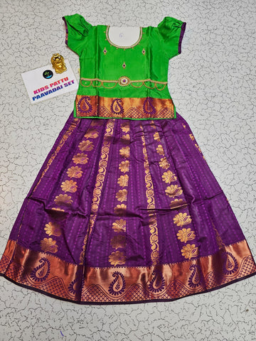 Kids Pattu Pavadai set with green top and purple zari woven skirt from Sri Thulir Tex.