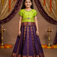 Kids Pattu Pavadai set with green semi-silk top and purple zari embroidered skirt from Sri Thulir Tex.