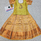 Kids pattu pavadai set with light green semi silk top and gold bridal silk skirt from Sri Thulir Tex
