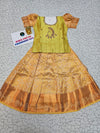 Kids pattu pavadai set with light green semi silk top and gold bridal silk skirt from Sri Thulir Tex