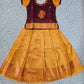 Kids maroon and golden yellow pattu pavadai set with puff sleeves and zari woven silk skirt from Sri Thulir Tex
