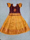 Kids maroon and golden yellow pattu pavadai set with puff sleeves and zari woven silk skirt from Sri Thulir Tex