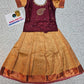 Kids maroon stone work blouse with mustard gold silk pattu pavadai set by Sri Thulir Tex