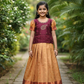Kids maroon stone work blouse with mustard gold silk pattu pavadai set by Sri Thulir Tex