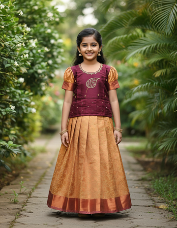 Kids maroon stone work blouse with mustard gold silk pattu pavadai set by Sri Thulir Tex