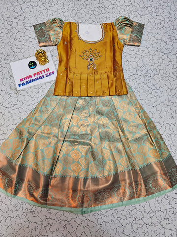 Kids pattu pavadai set with mustard yellow top and aqua bridsl silk skirt from Sri Thulir Tex
