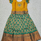 Kids pattu pavadai with mustard semi-silk top and green bridal silk skirt – Sri Thulir Tex traditional wear.