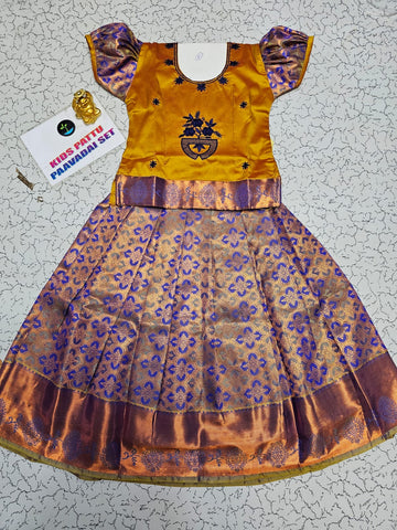 Kids pattu pavadai set with mustard yellow top and purple bridal silk skirt from Sri Thulir Tex