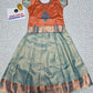 Kids orange and aqua blue pattu pavadai set with puff sleeve blouse and zari silk skirt from Sri Thulir Tex