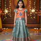Kids orange and aqua blue pattu pavadai set with puff sleeve blouse and zari silk skirt from Sri Thulir Tex