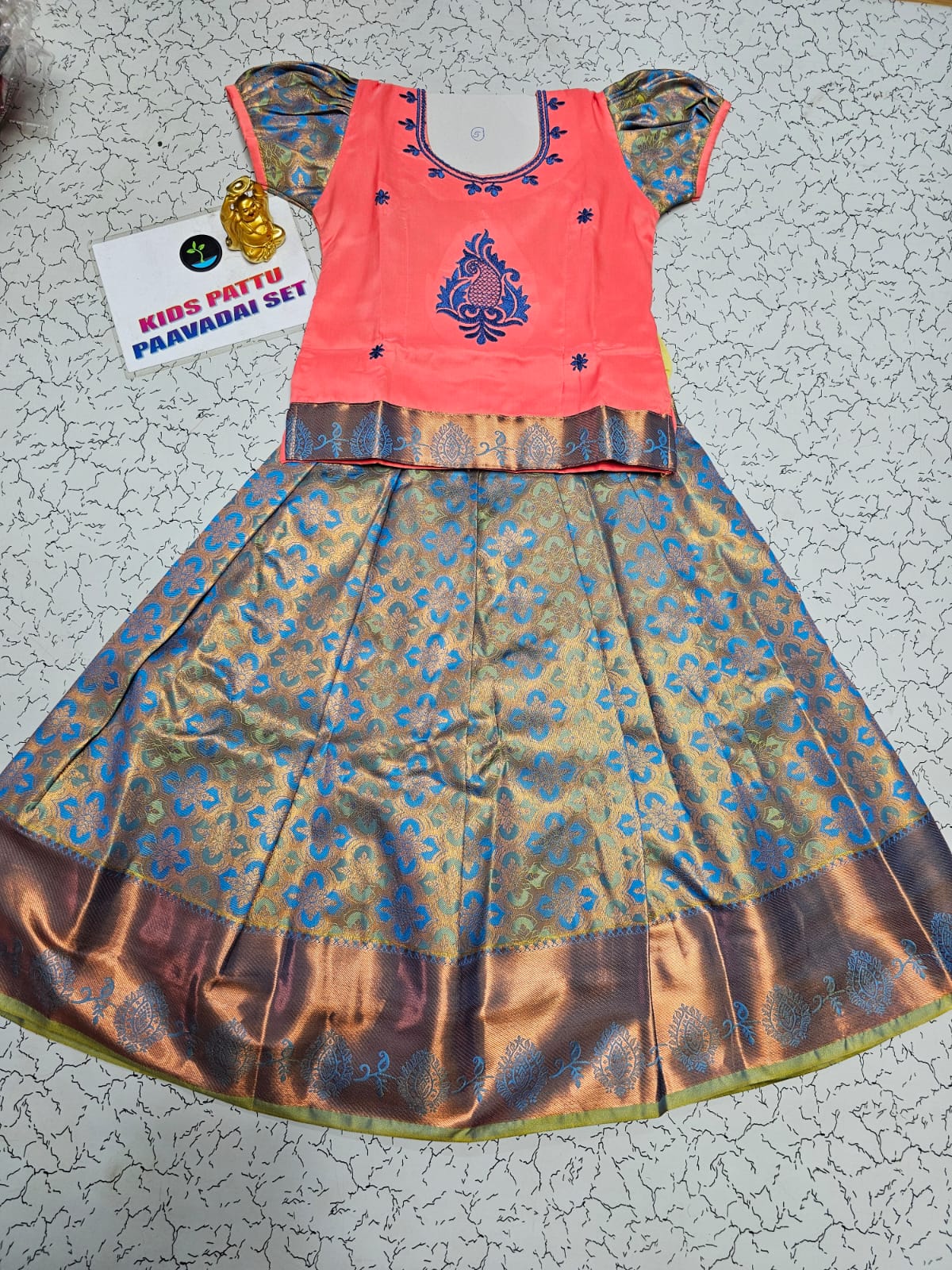 Kids peach and blue pattu pavadai set with puff sleeve blouse and zari woven bridal silk skirt from Sri Thulir Tex