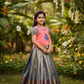 Kids peach and blue pattu pavadai set with puff sleeve blouse and zari woven bridal silk skirt from Sri Thulir Tex