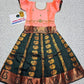 Kids Pattu Pavadai set with peach top and dark green zari woven skirt from Sri Thulir Tex.