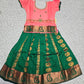 Kids Pattu Pavadai set with peach stone-work top and green zari woven skirt from Sri Thulir Tex.