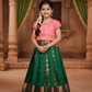 Kids Pattu Pavadai set with peach stone-work top and green zari woven skirt from Sri Thulir Tex.