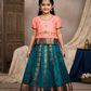 Kids Pattu Pavadai set with peach top and teal zari embroidered skirt from Sri Thulir Tex.