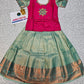 Kids pattu pavadai set with pink stone work blouse and green silk skirt by Sri Thulir Tex