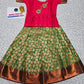 Kids pink semi-silk top with green and gold bridal silk pattu pavadai set by Sri Thulir Tex