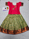 Kids pink semi-silk top with green and gold bridal silk pattu pavadai set by Sri Thulir Tex