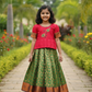 Kids pink semi-silk top with green and gold bridal silk pattu pavadai set by Sri Thulir Tex