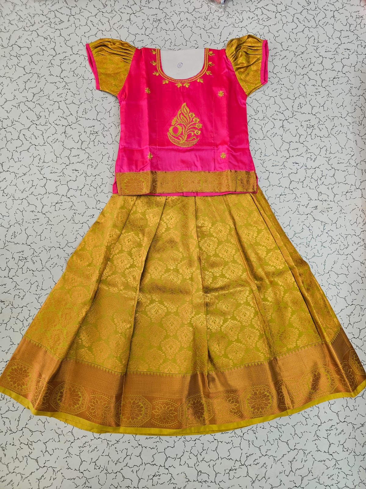 Kids pink and mustard gold pattu pavadai set with puff sleeves and zari woven silk skirt from Sri Thulir Tex