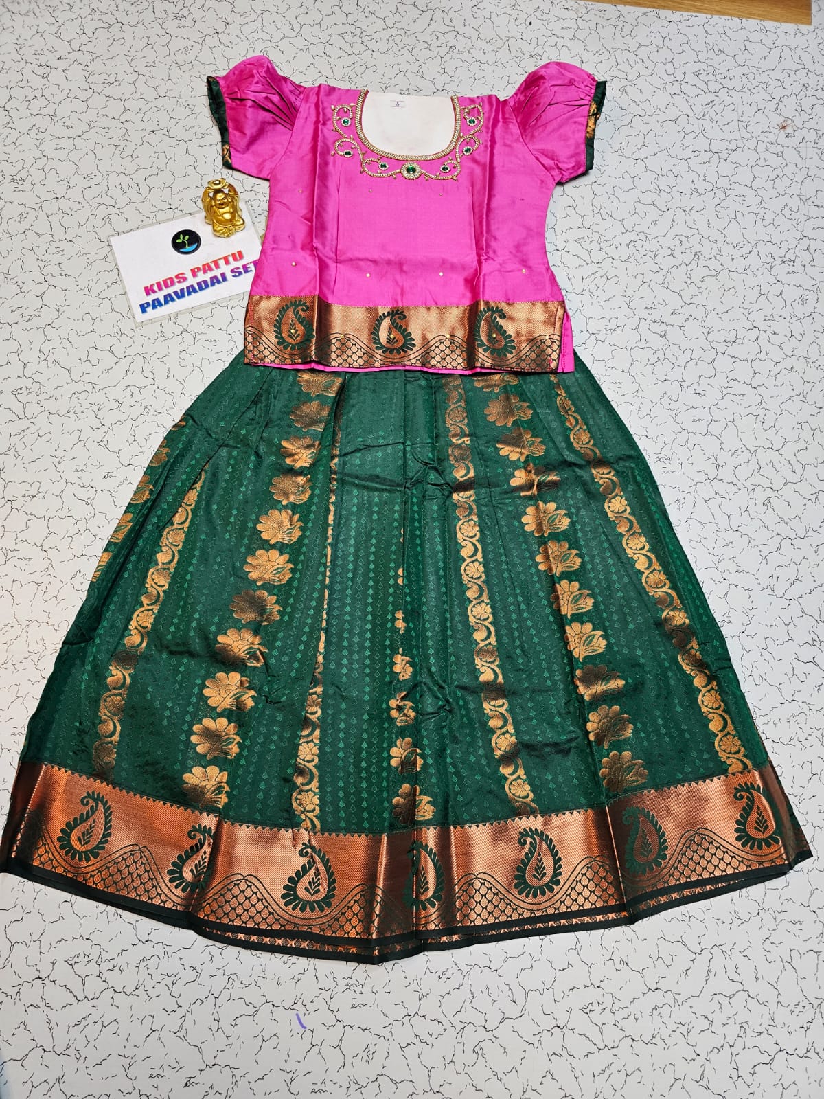 Kids pattu pavadai with pink semi silk top and bottle green emboss skirt – Sri Thulir Tex