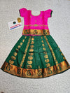 Kids pattu pavadai with pink top and dark green emboss skirt – Sri Thulir Tex