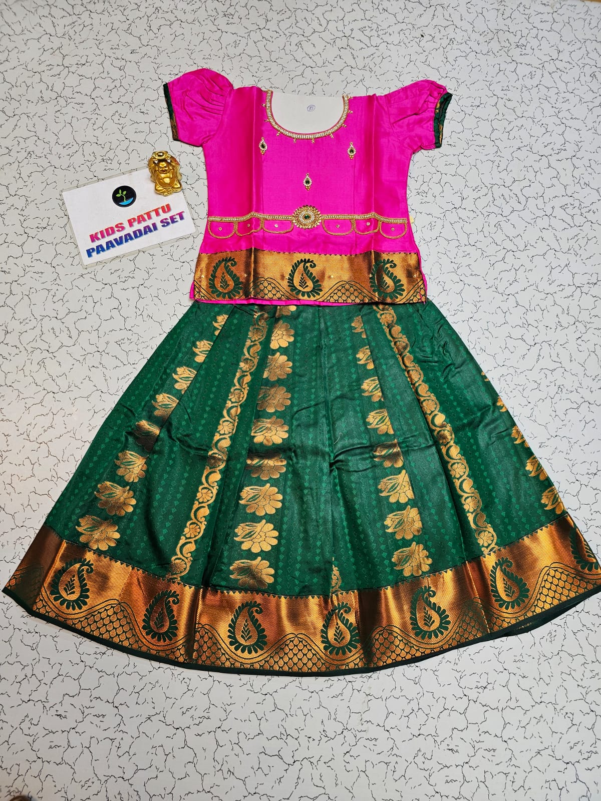 Kids pattu pavadai with pink top and dark green emboss skirt – Sri Thulir Tex
