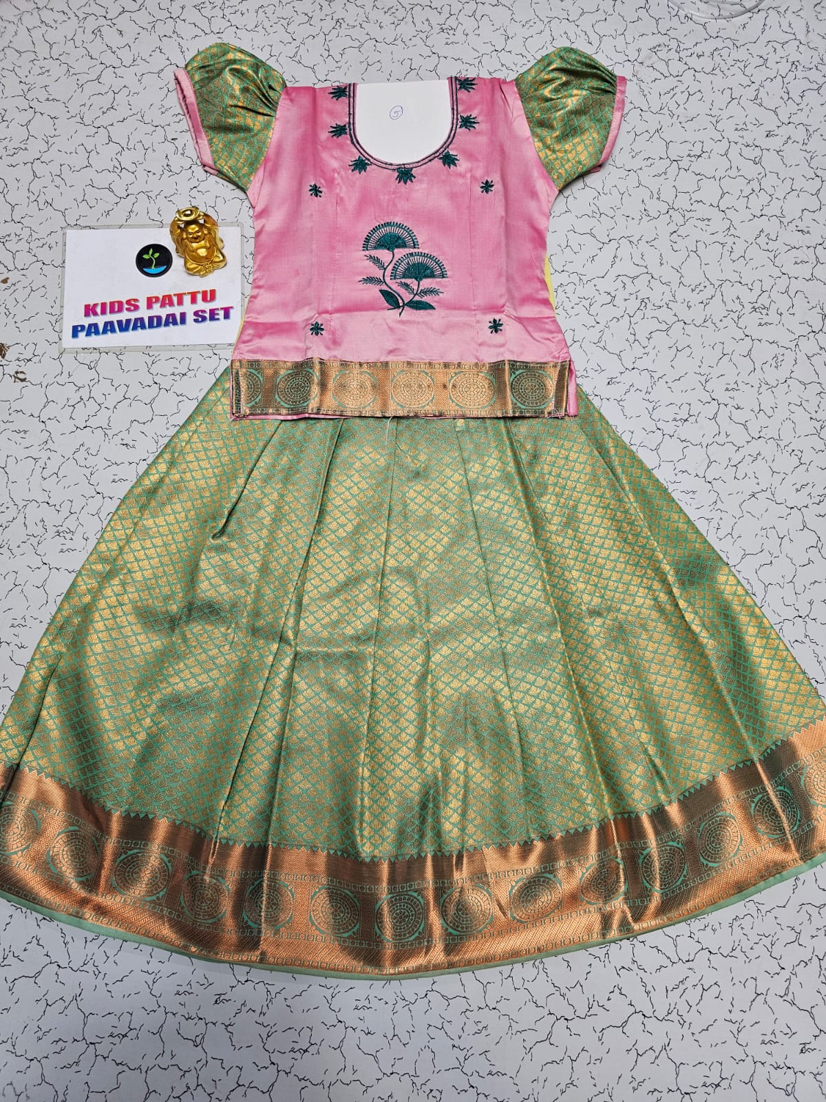Kids pattu pavadai set with pink top and green silk skirt from Sri Thulir Tex