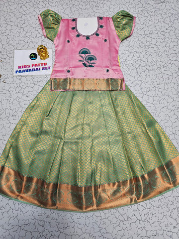 Kids pattu pavadai set with pink top and green silk skirt from Sri Thulir Tex