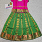 Kids Pattu Pavadai set with pink top and green zari woven skirt from Sri Thulir Tex.