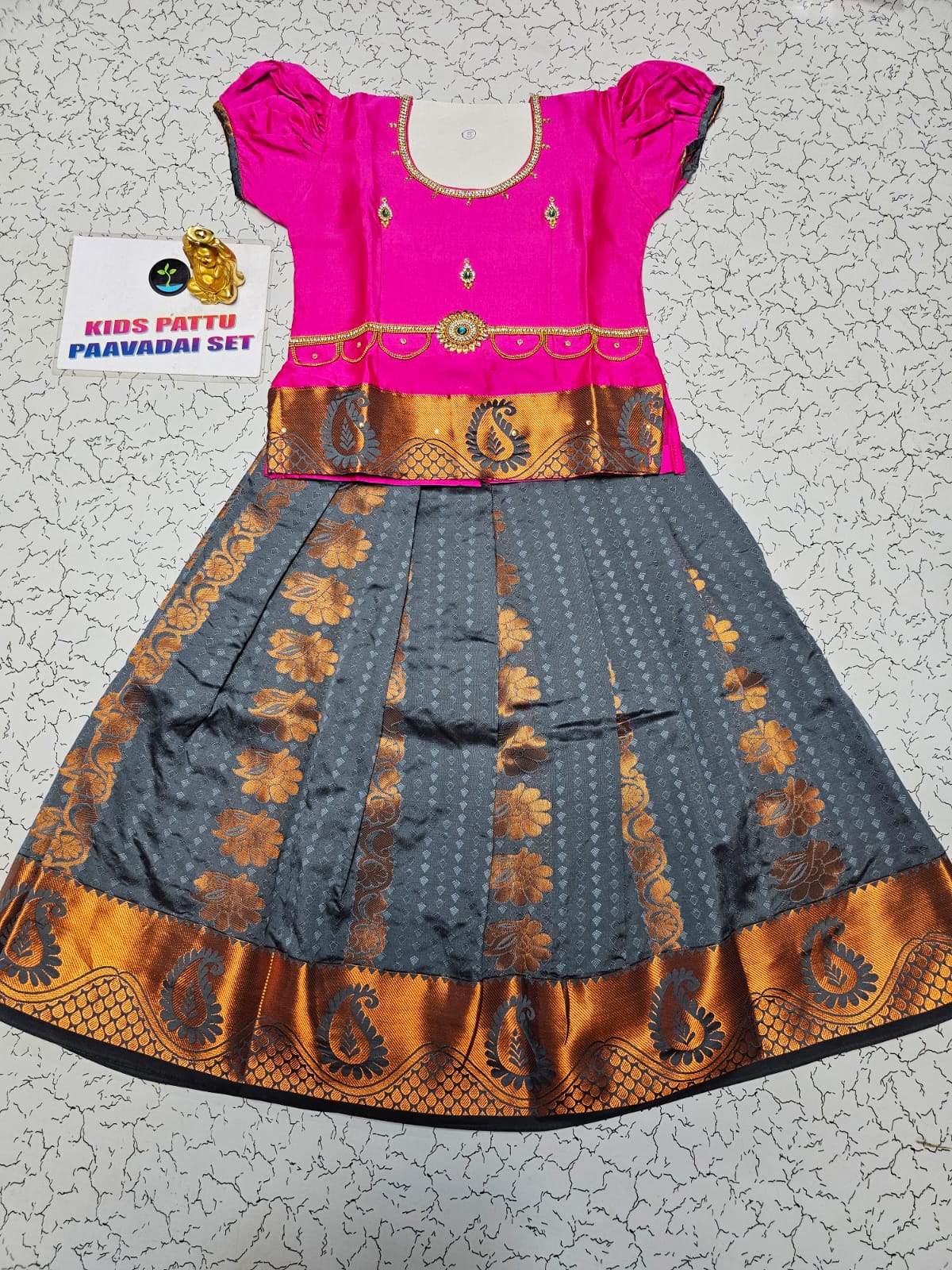 Kids Pattu Pavadai set with pink top and grey zari woven skirt from Sri Thulir Tex.