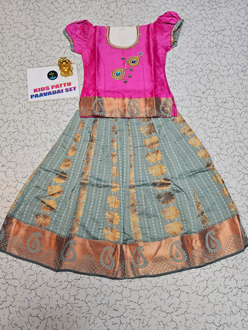 Kids Pattu Pavadai set with pink top and light green zari woven skirt from Sri Thulir Tex.
