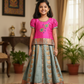 Kids Pattu Pavadai set with pink top and light green zari woven skirt from Sri Thulir Tex.