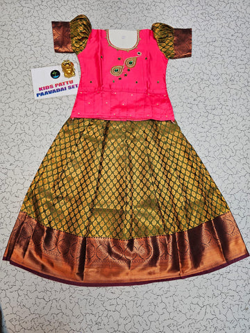Kids Pattu Pavadai set with pink stone-work top and olive green zari woven skirt from Sri Thulir Tex.