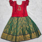 Kids red semi silk top with dark green bridal silk pattu pavadai set by Sri Thulir Tex
