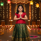 Kids red semi silk top with dark green bridal silk pattu pavadai set by Sri Thulir Tex