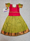 Kids pattu pavadai set with red semi silk top and green bridal silk skirt from Sri Thulir Tex