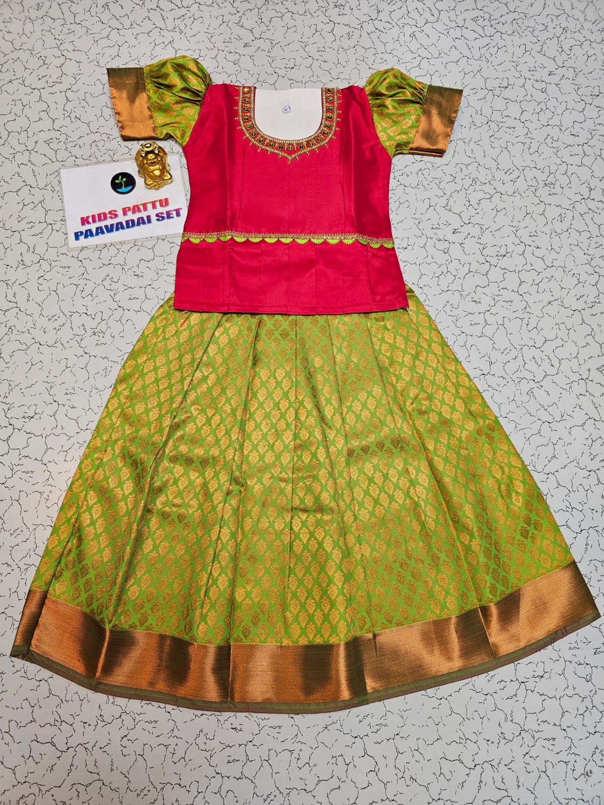 Kids pattu pavadai set with red semi silk top and green bridal silk skirt from Sri Thulir Tex