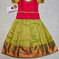 Kids Pattu Pavadai set with red stone-work top and green zari woven skirt from Sri Thulir Tex.