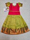 Kids Pattu Pavadai set with red stone-work top and green zari woven skirt from Sri Thulir Tex.