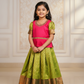 Kids Pattu Pavadai set with red stone-work top and green zari woven skirt from Sri Thulir Tex.
