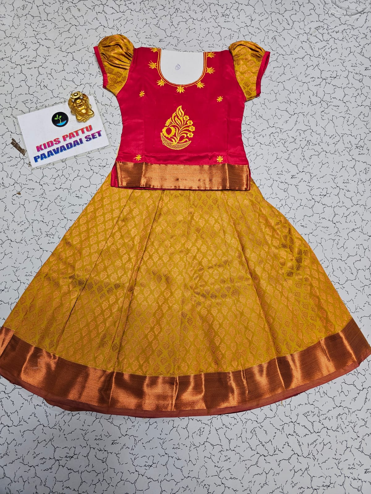Kids pattu pavadai set with red semi-silk top and mustard gold bridal silk skirt by Sri Thulir Tex